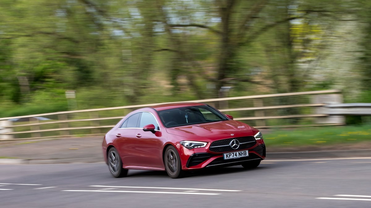 Red Mercedes Benz on road